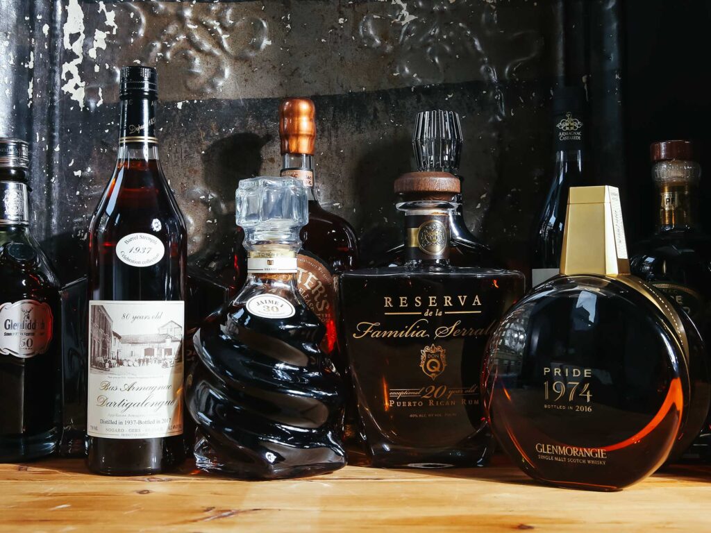 A table with several different types of alcohol.